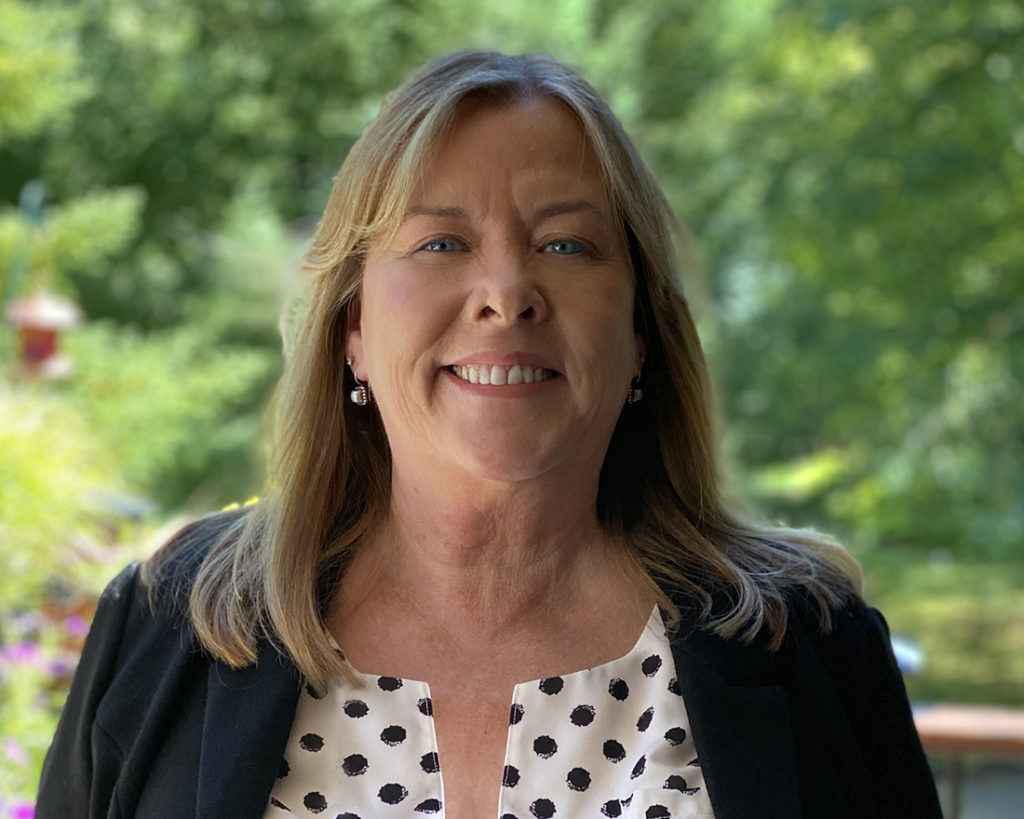 Kim Ross smiling in a headshot photo