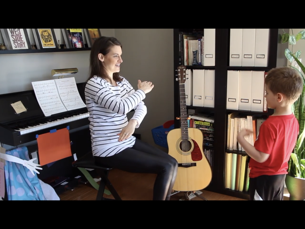Jill Boyd with son and helper, Tommy, in their home "studio" where she conducts Music Insights classes online.
