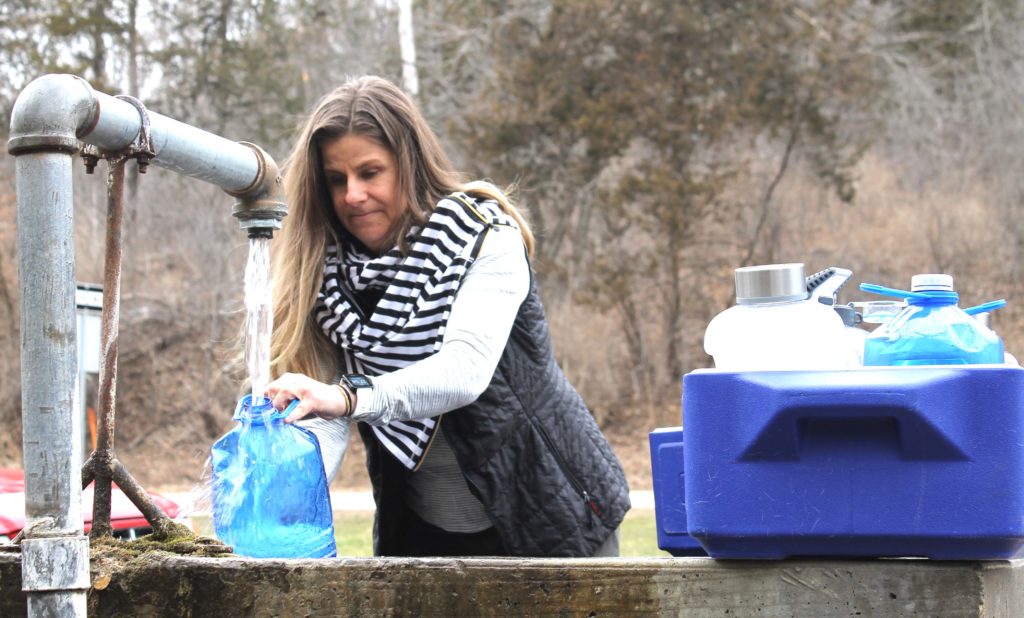 Amy Anderson, of Victoria, stopped Tuesday at Fredrick-Miller Spring, which is drawing attention because of development proposed nearby.