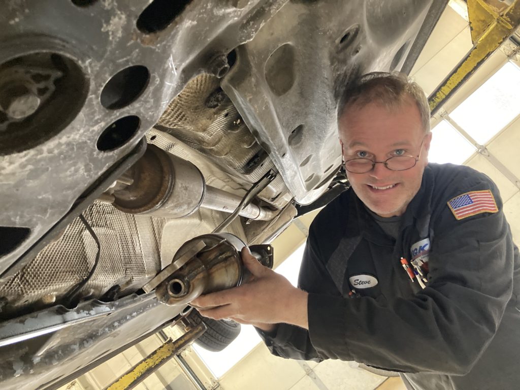 Mechanic Steve Wohl at TGK Automotive, 9051 Flying Cloud Drive, with a "cat." So far this year, TGK has replaced six cats stolen from Eden Prairie cars.
