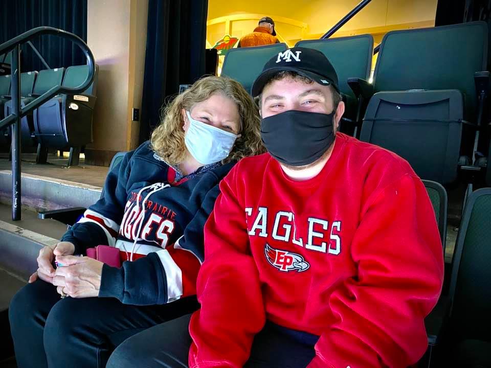 EPLN reporter Ryan Williamson, and his mother, Marla Williamson, take in the 2021 Class 2A boys' semifinal between Eden Prairie and Maple Grove. Photo courtesy of Ryan Williamson.