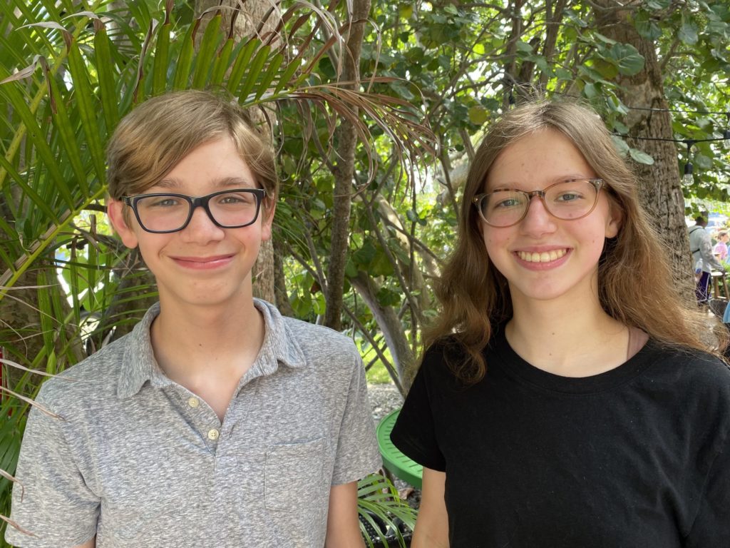 A picture of a boy and girl in glasses