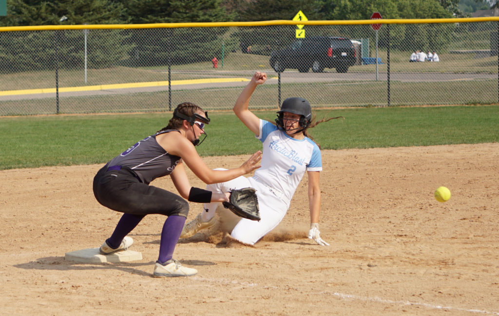 Arctic Blast first baseman Annika Welter slid into third base ahead of a tag Friday at Miller Park against the Onalaska Force. Welter went 3-for-4 in the 12-1 Blast victory. Photo by Holly Isaacson