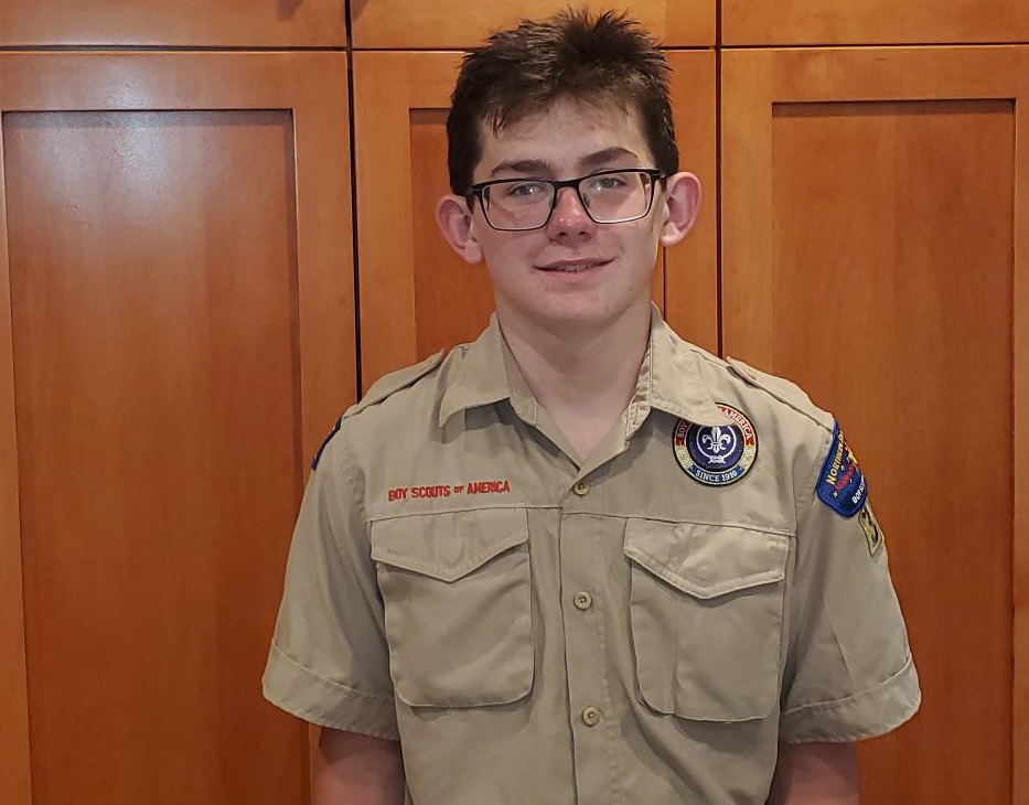 A picture of a scout boy in uniform