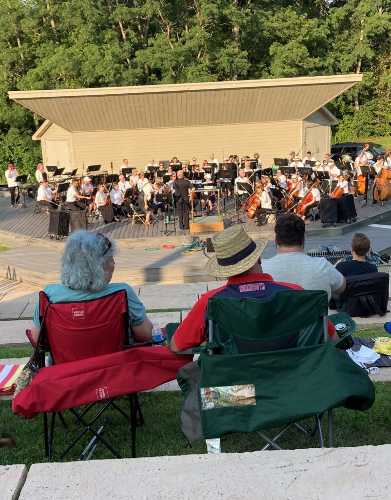 A picture of a band performing surround by audience