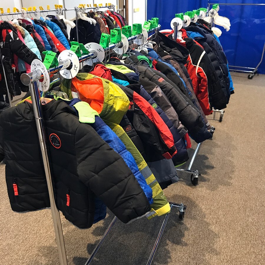 A display of hanging winter coats
