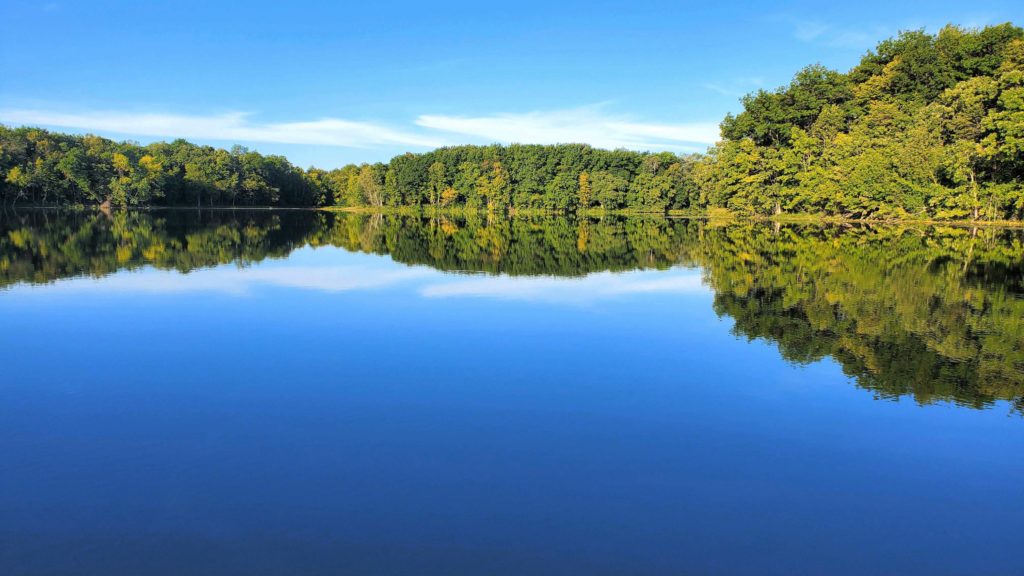 Mitchell Lake looks like a glass reflection the morning of Labor Day, Sept. 6.