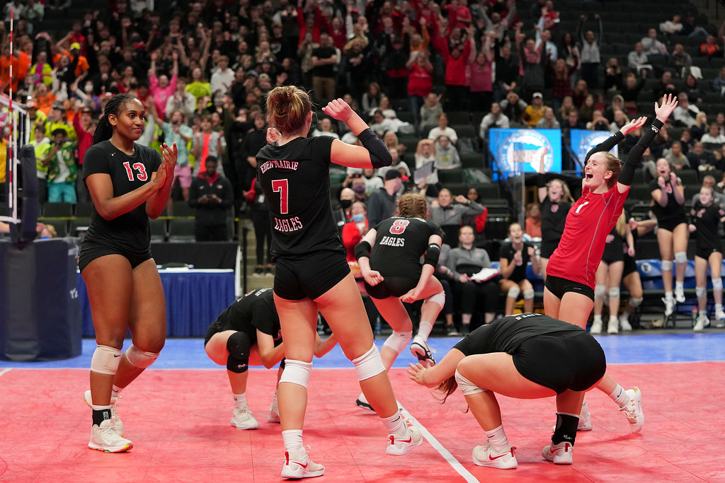 The EP volleyball team celebrates after clinching a hard-fought match against Forest Lake. Photo by Rick Olson