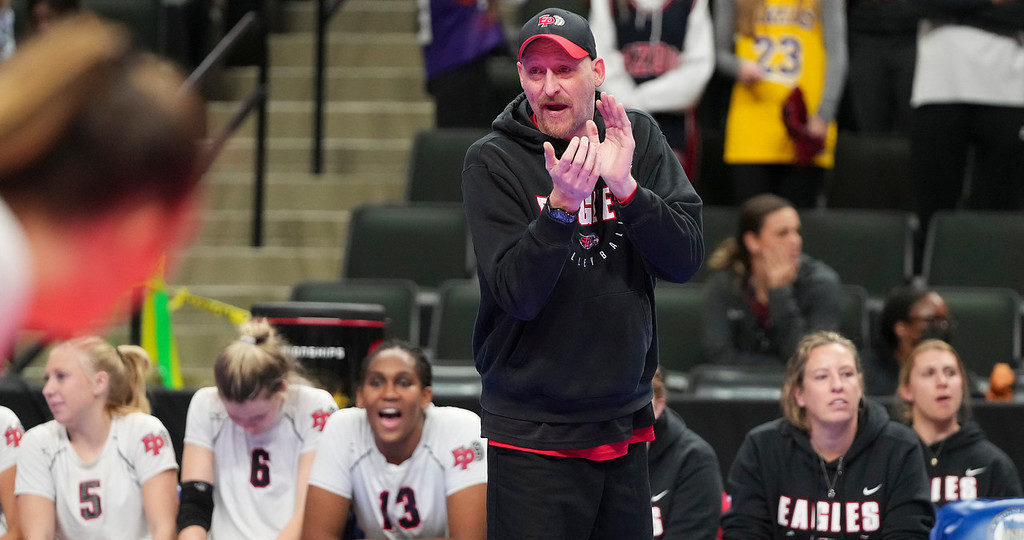 EP volleyball coach Chad Becker cheers on his players during the Class 4A state semifinal against East Ridge. Photo by Rick Olson