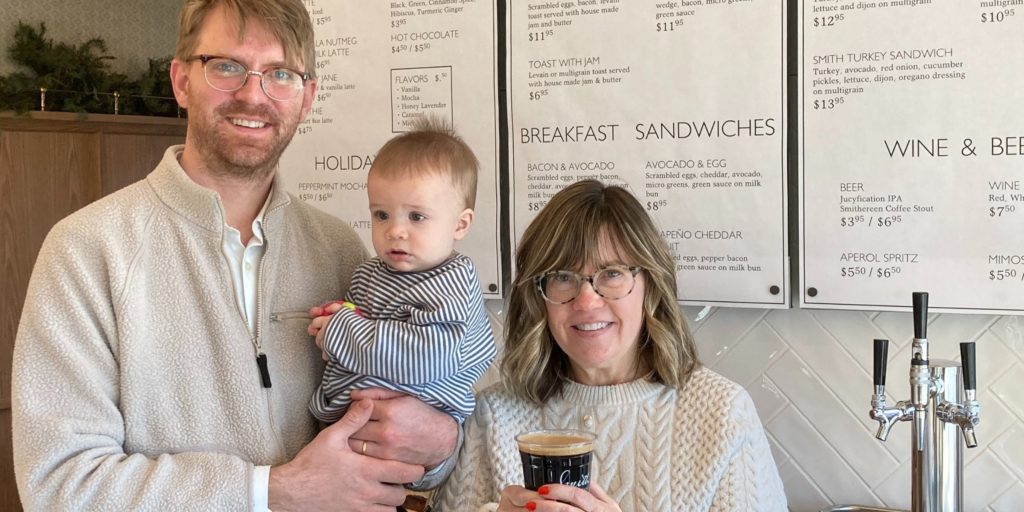 Ann Schuster, right, holds a glass of Smithereen alongside son Alex and Alex’s son, Lew. Photos by Mark Weber