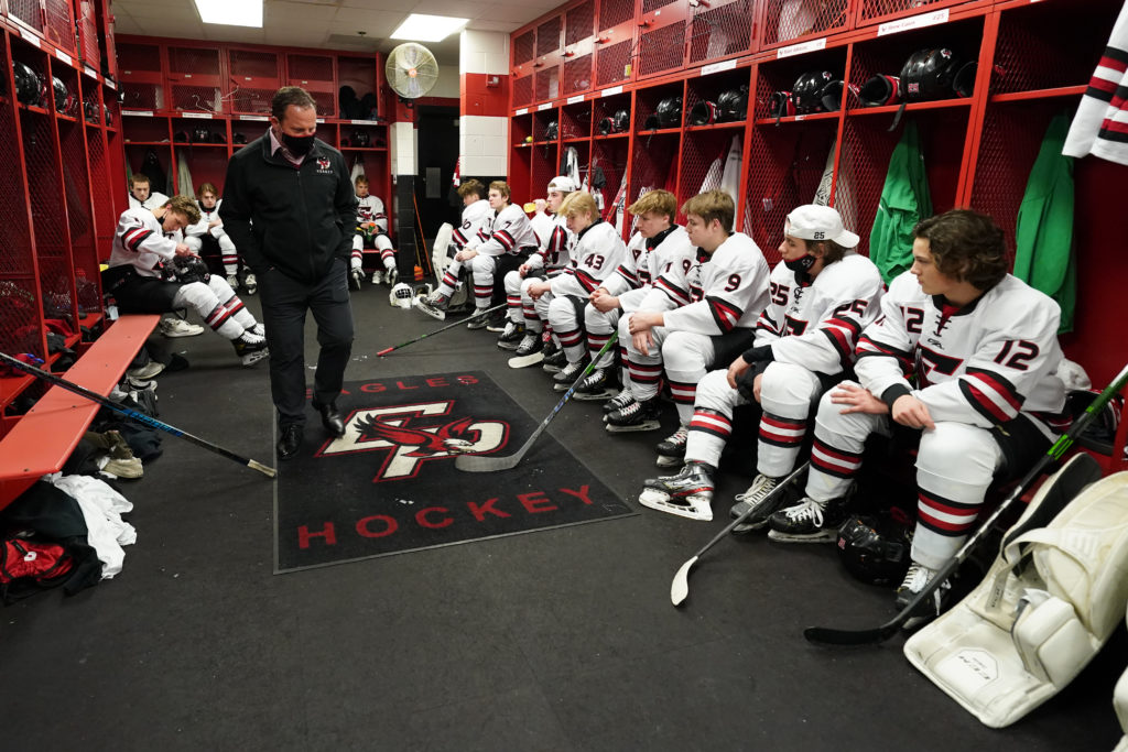 Lee Smith talking to his team in the locker room last season. Photo by Rick Olson