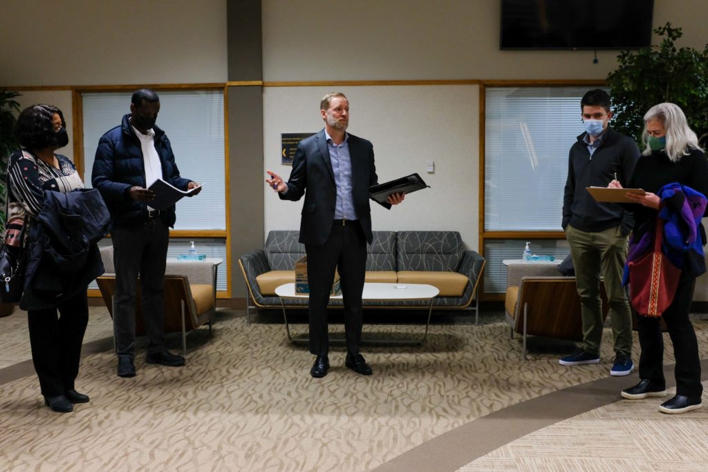Eden Prairie Human Rights and Diversity Commission Chair Greg Leeper (center) presented the Race Equity Report at the Jan. 4 city council meeting. Photos by Gillian Holte