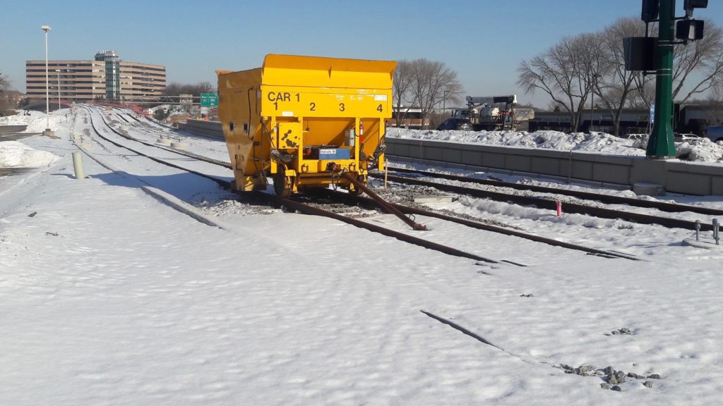 Recently laid tracks along Flying Cloud Drive on Valentine's Day might not see light rail cars until 2027. Photo by Jeff Strate
