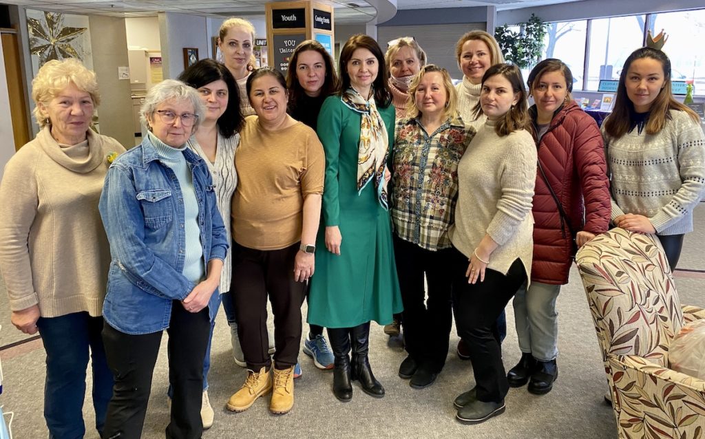Some of the teachers, volunteers and parents at the Russian Educational Center pose for a photo. (From left) Lidiia Zubitska, Olga Sagalovsky, Maria Zelinsky, Volha Kanapliova, Lola Sayfullaeva, Kateryna Kent, Svetlana Goldenfang, Liliya Beliakala, Anzhela Linn, Larissa Rudashevsky, Daria Dzhalalova, Anna Vainerman, and Regina Marinina. Photo by Stuart Sudak 