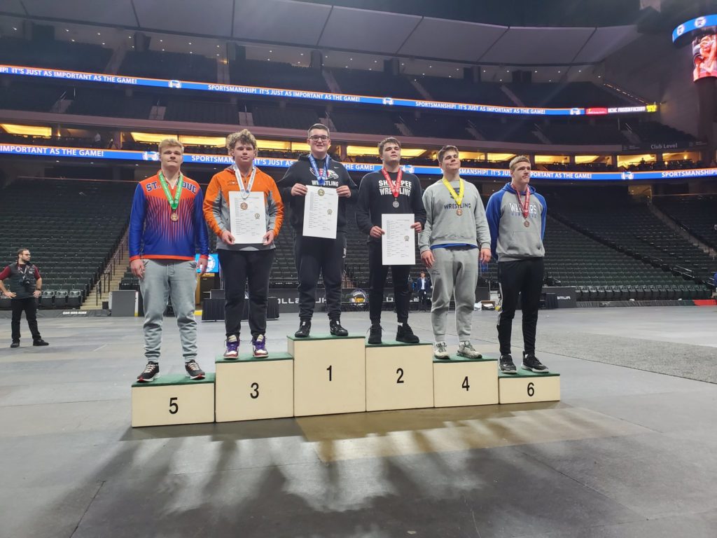 Will Sather (center) became the first sophomore to ever win the heavyweight individual state wrestling crown in Class 3A. Photo courtesy of EPHS wrestling