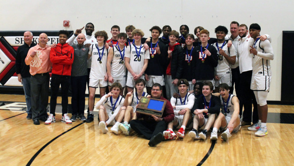 The EP boys' basketball team poses with medals and a trophy following the team's win in the Section 2AAAA final. Photos by Ryan Williamson