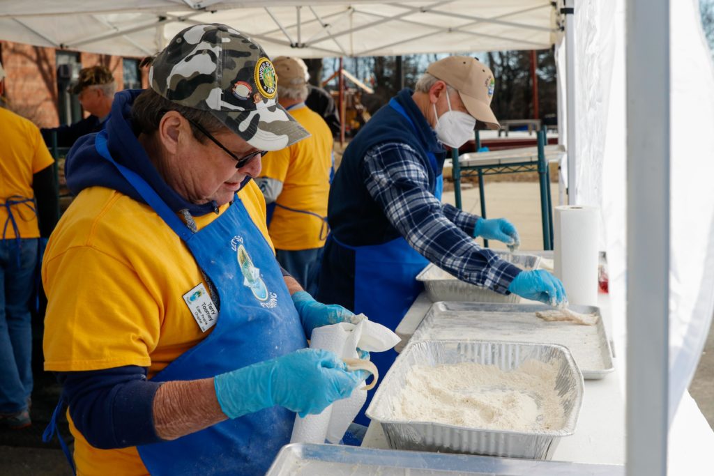 Terry Toomey prepares the fish to be fried.