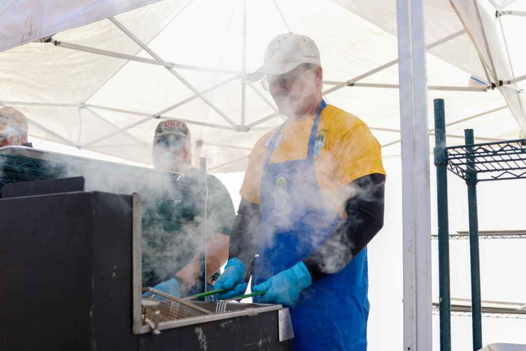 The Let's Go Fishing Eden Prairie Area Chapter serves several hundred pounds of fish at its annual fish fry fundraiser. File photo by Gillian Holte