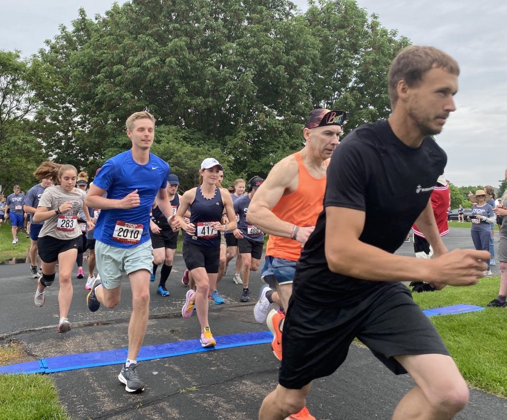 Last year's Stop the Trafficking 5K Walk/Run for Justice kicks off as runners dash from the starting line at Purgatory Creek Park. File photo by Stuart Sudak