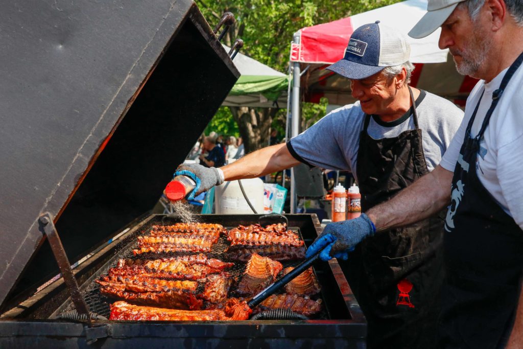 Brad Freeman and Tom Herzog cook the ribs. 