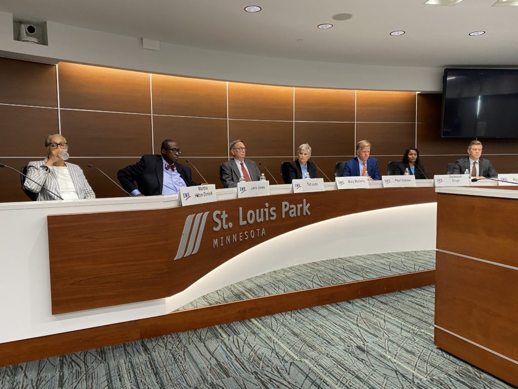 (From left) Martha Holton Dimick, Jarvis Jones, Tad Jude, Mary Moriarty, Paul Ostrow, Saraswati Singh, and Ryan Winkler during Tuesday's candidate forum for Hennepin County Attorney. Photo by Frank Malley