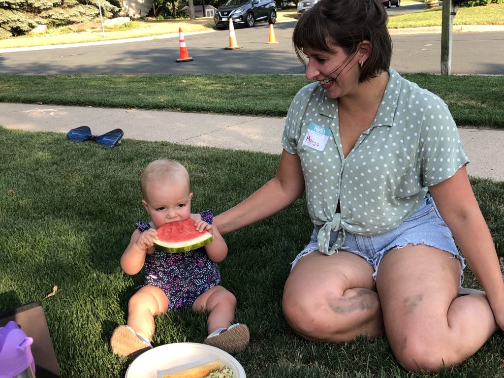 Baby Petra and mom Margo, who recently moved to the neighborhood, got to know some of their neighbors at the Night to Unite block party on Grant Drive.