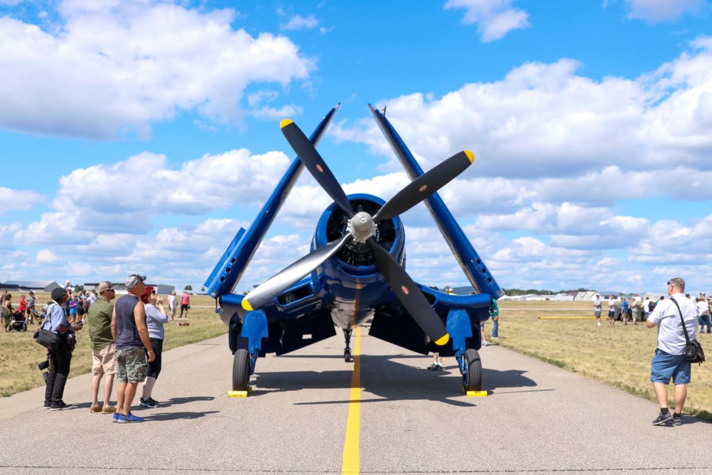 A group of spectators watching a plane in