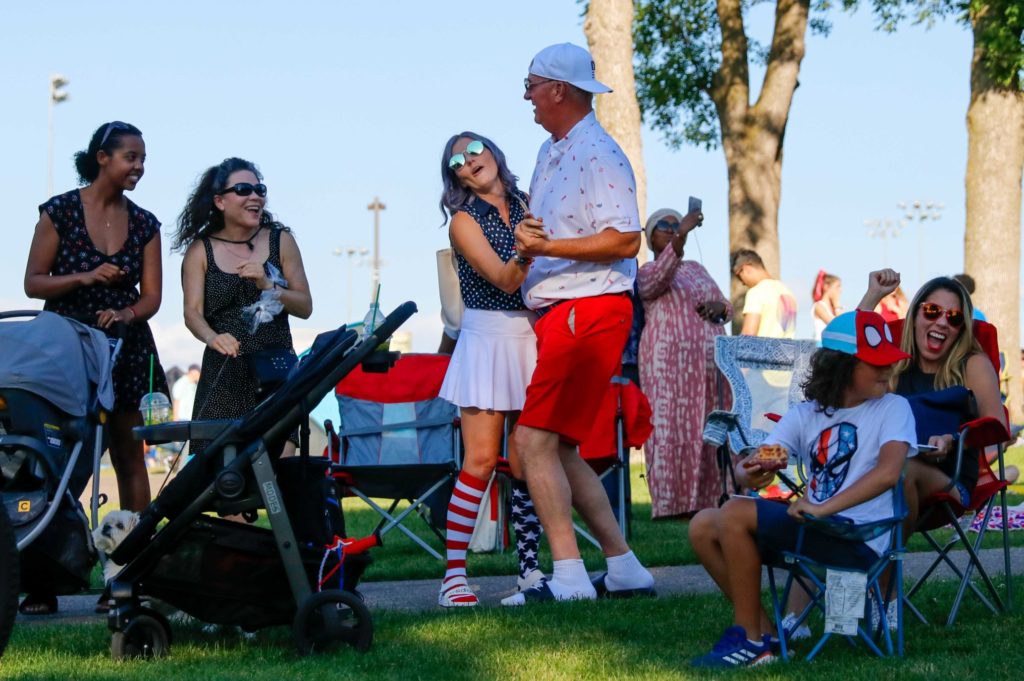 A couple dances to the music near the Round Lake Park stage during a past 4th of July Hometown Celebration. File photo by Gillian Holte