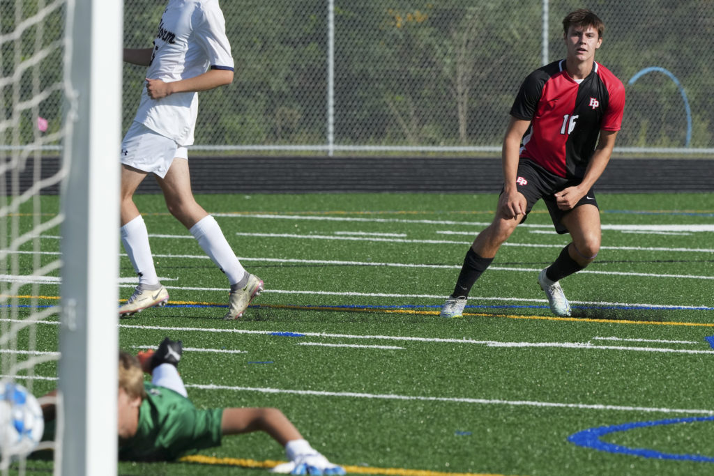 Eagles’ junior forward Ryan Donohue’s watches his shot go in as the Eagles take a 1-0 lead. Photo by Rick Olson
