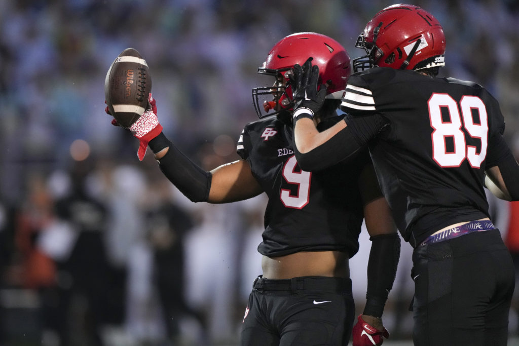 Eagles’ senior defensive end Chiddi Obiazor forced a fumble Friday night vs. Farminton. Photo by Rick Olson