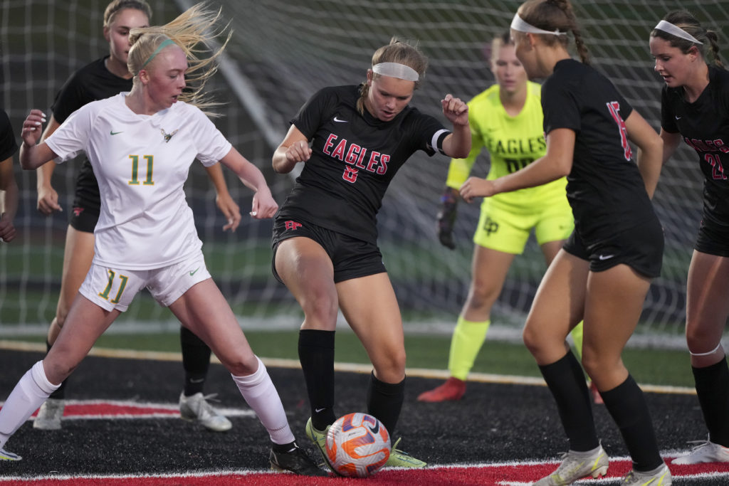 Eagles’ senior defender Eleanor Thomas battles for the ball vs Edina Wednesday night. Photo by Rick Olson