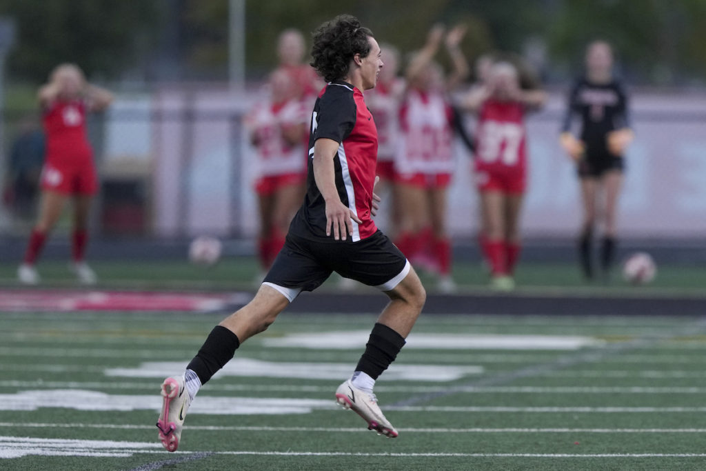 Eagles’ senior forward Zachary Fier celebrates his game-winning goal vs. Wayzata on Monday. Photo by Rick Olson