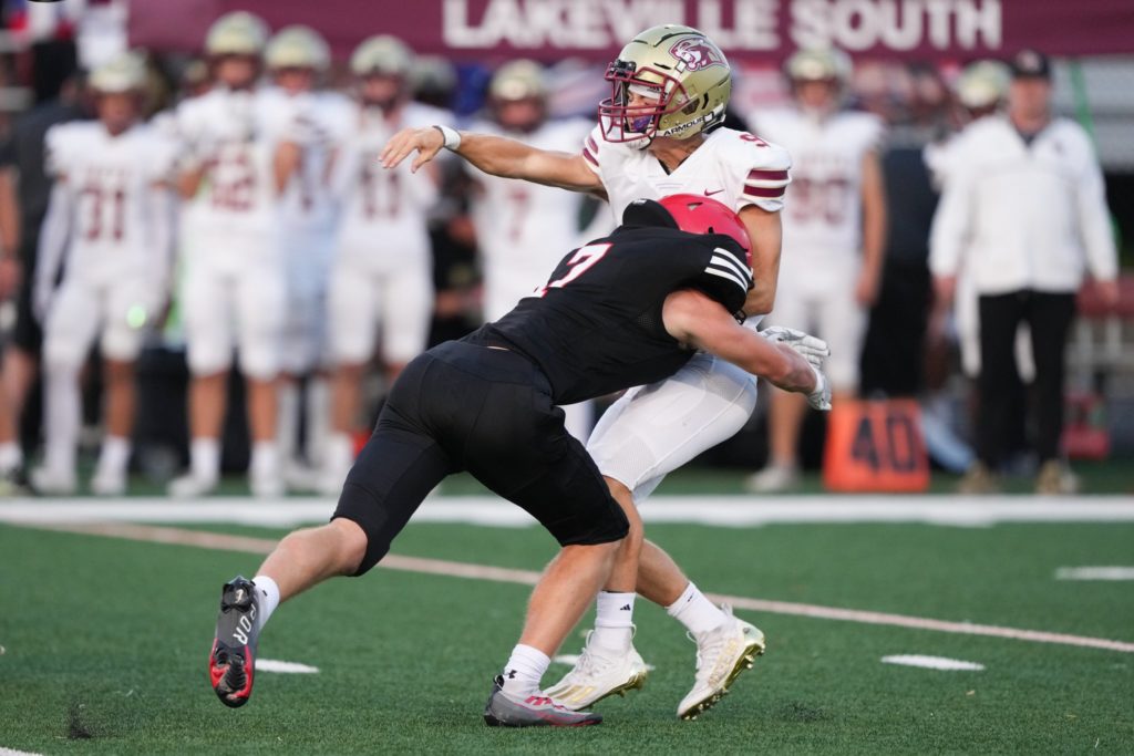 Eagles linebacker Adam Mertens' hit on the Lakeville South quarterback helped set up Eden Prairie's first touchdown in the Eagles' 21-6 win over Lakeville South. Photo by Rick Olson