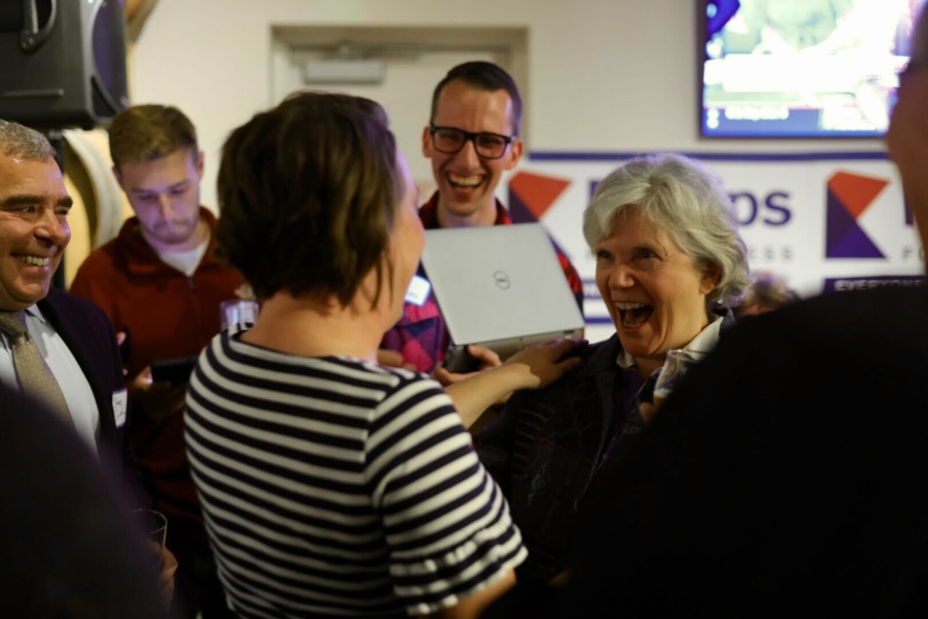 State Reps. Carlie Kotyza-Witthuhn and Laurie Pryor celebrate winning reelection during an election party in Minnetonka on Tuesday night. At left is state Sen. Steve Cwodzinski, who also won reelection.