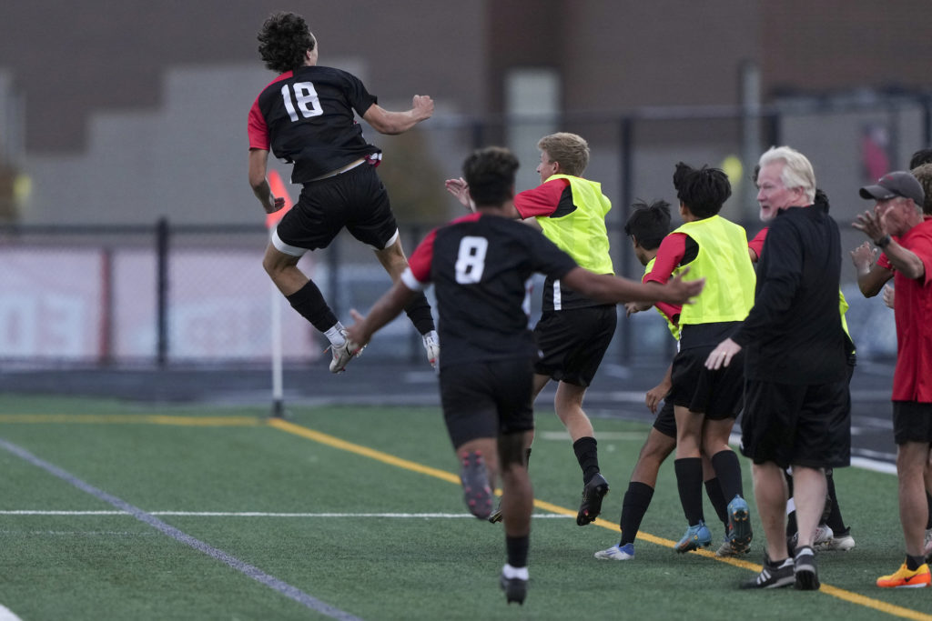 Eagles’ senior forward Zachary Fier celebrates his game-winning goal vs. Wayzata on Monday. Photo by Rick Olson