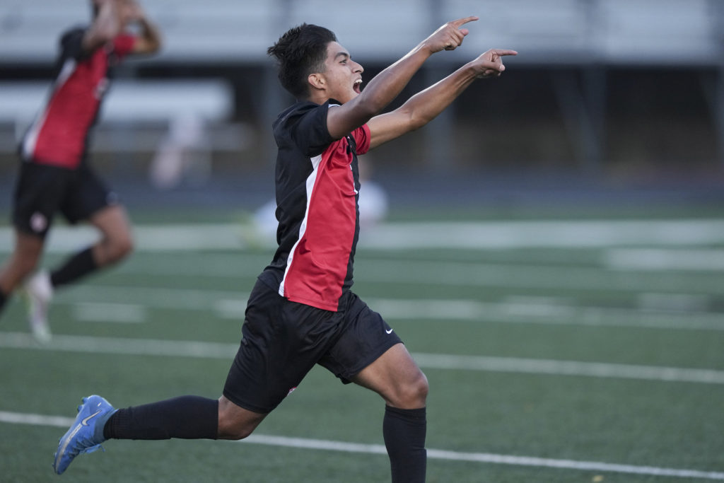 Eagles senior forward Sebastian Bocanegra-Lima (7) celebrates his game-winning goal in
overtime vs. Chanhassen. Photo by Rick Olson