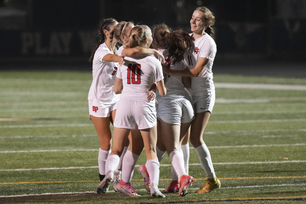 The Eagles celebrate Elisabeth Rupp’s (10) PK goal in the first half vs Edina. Photo by Rick Olson
