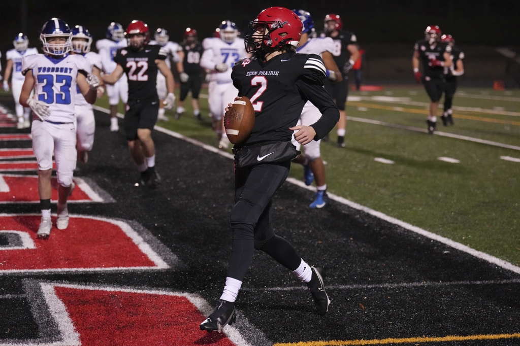 Eden Prairie quarterback Nick Fazi (2) ran for a touchdown in the second quarter of the Eagles' 55-14 win over Woodbury. Photo by Rick Olson