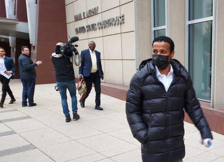 Former Feeding Our Future employee Hadith Yusuf Ahmed, right, of Eden Prairie, leaves the federal courthouse in downtown Minneapolis on Oct. 13 with his attorney, Richard Dansoh, left. Hadith pleaded guilty to food-aid fraud. Photos by Joey Peters of the Sahan Journal