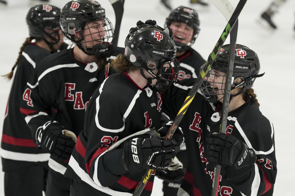 Annabel Mehta (4/left) and Gianna Kowalkoski (18/right) celebrate Natalie McNeal’s (21/center) goal in the second period Tuesday vs Chaska/Chanhassen. Photo by Rick Olson