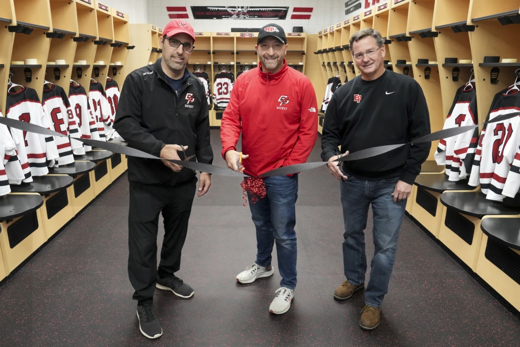 From left, EPHS boys varsity hockey coach Mike Terwilliger, EPHS associate principal of student activities Russ Reetz, EPHS girls varsity hockey coach Steve Persian. Photo by Rick Olson