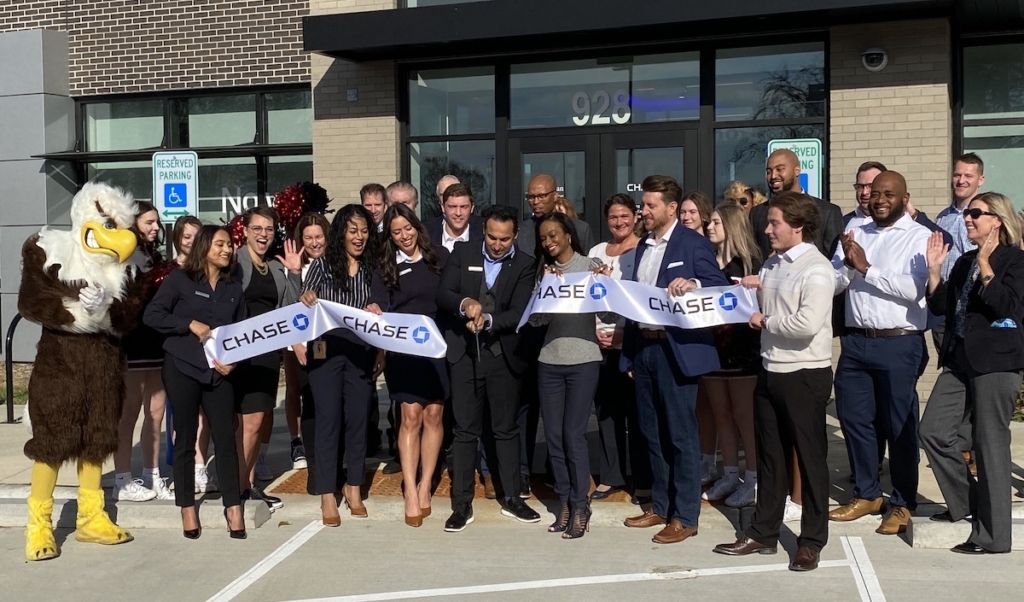 Chase celebrated the opening of its Eden Prairie branch with a ribbon-cutting ceremony earlier this month. Holding the scissors is Mohamed Zaza, Chase branch manager in Eden Prairie. To his right are Racquel Oden, head of network expansion for JPMorgan Chase and Matthew Gustafson, market director, banking at Chase. Photos by Stuart Sudak