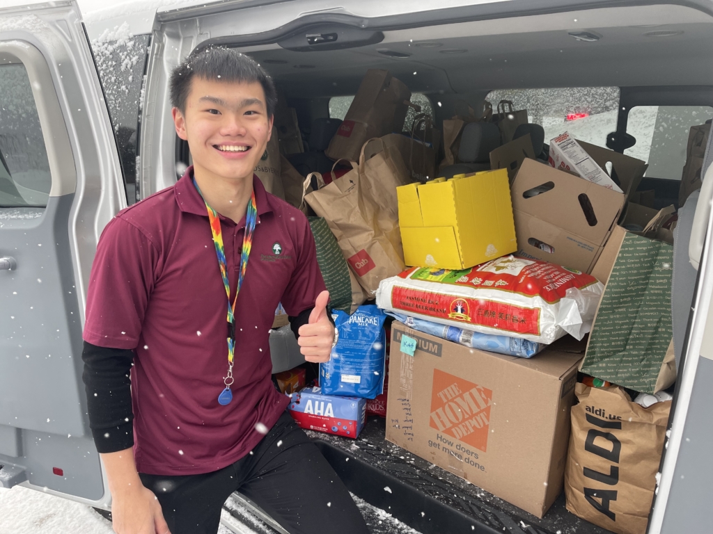 ISM student Andrew Cheng helped deliver  1,938 pounds of food and daily essentials to PROP on Monday, Nov. 14. Photo by Sarah Bianucci