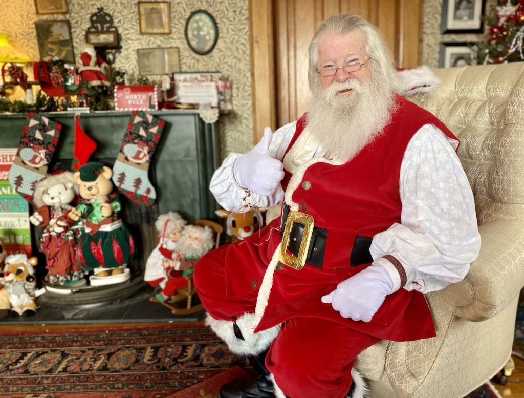 Arlyn Grussing, the longtime Santa at the Cummins-Phipps-Grill House, during Santa’s North Pole Experience in 2022. Grussing, who created a cherished holiday tradition in Eden Prairie, died on March 8 at age 80.