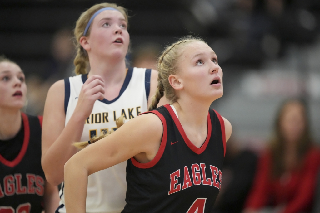 Eagles senior forward and captain Kylie Bamlett (4) positions for a rebound Wednesday vs. Prior Lake. Photo by Rick Olson