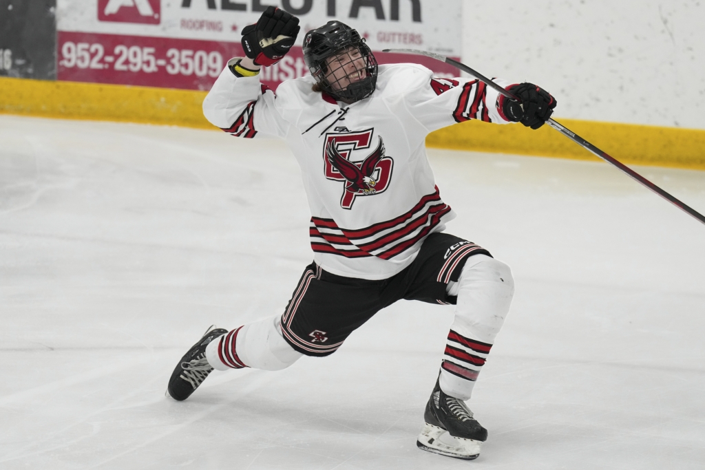 Junior forward Cole Saterdalen (41) celebrates his goal that gave the Eagles a 1-0 lead in the third period vs. Grand Rapids, Friday at the Edina Holiday Classic. Photo by Rick Olson