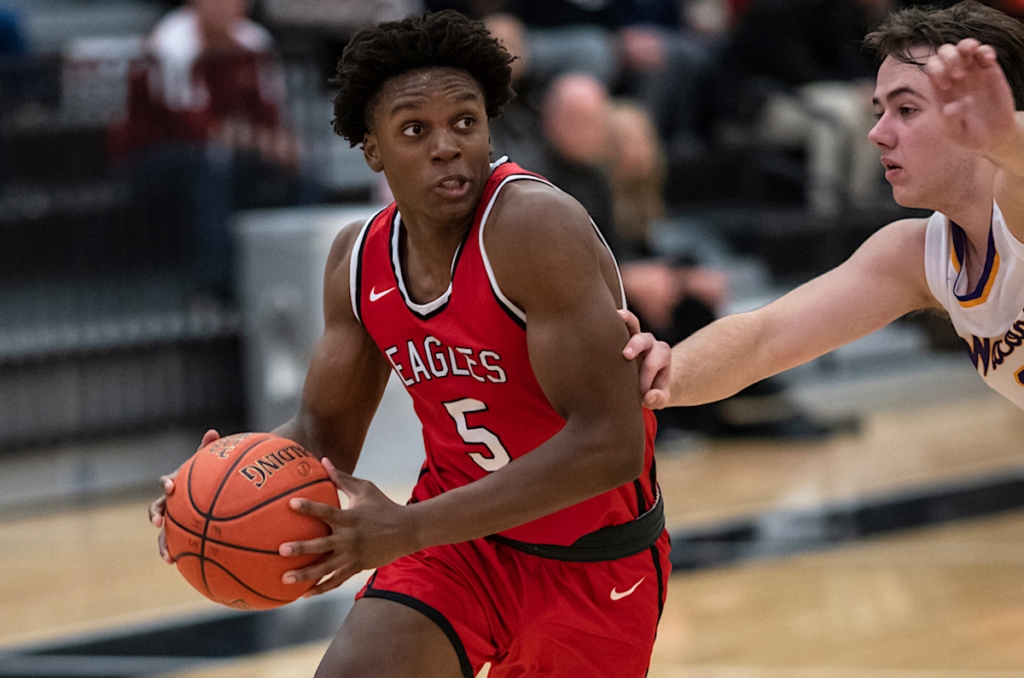 Eagles Senior Quincy Oriwa (5) drives toward the basket in Tuesday’s win over Waconia. Photo by Jeremy Peyer