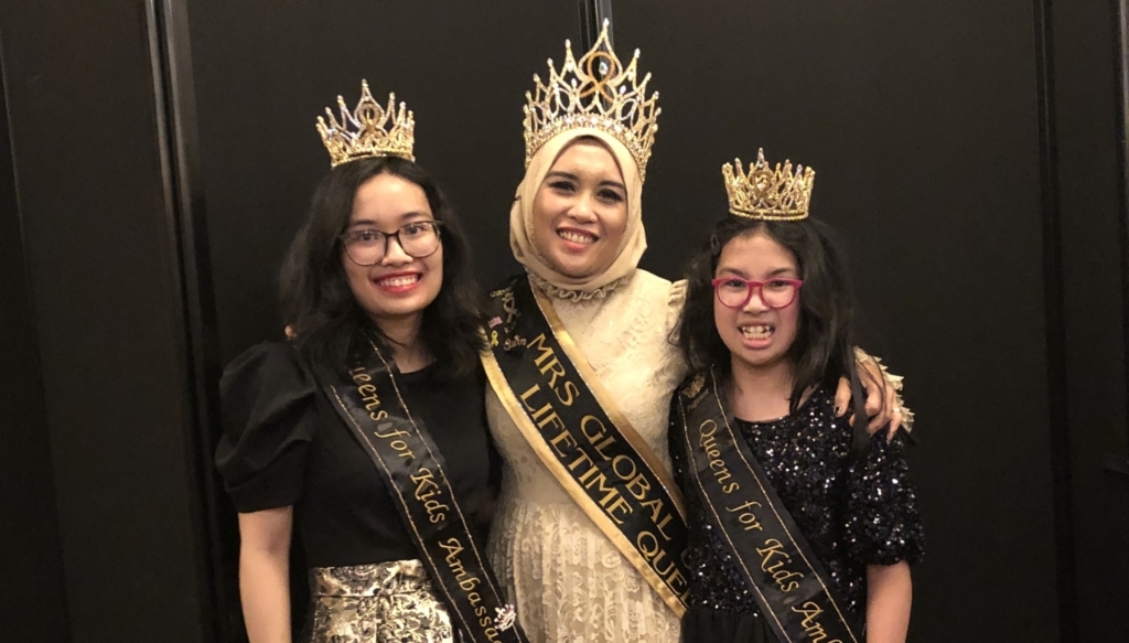 Melissa Redzuan (center) and daughters Amirah Razman (left) and Amilia Razman (right) wearing Lifetime Queen and Queens for Kids Ambassadors crowns from the Global United Pageant.
