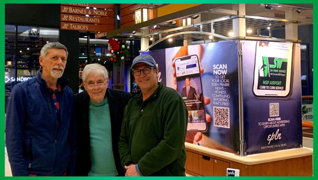 Eden Prairie Local News board members Mark Weber, Jeff Strate and David Lindahl set up EPLN's kiosk at Eden Prairie center Mall Monday afternoon.