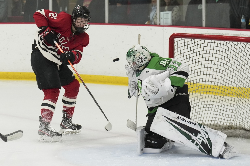 Eagles junior forward Billie Jacobson-Couch (21) rushes the net against Hill-Murray Friday night. Photo by Rick Olson
